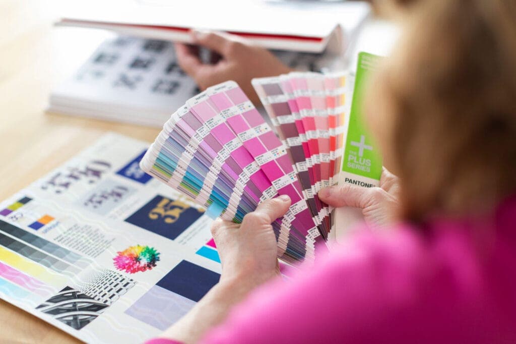 Woman flipping through Pantone colors