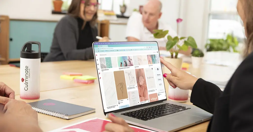 Woman scrolling through a mood board on her computer