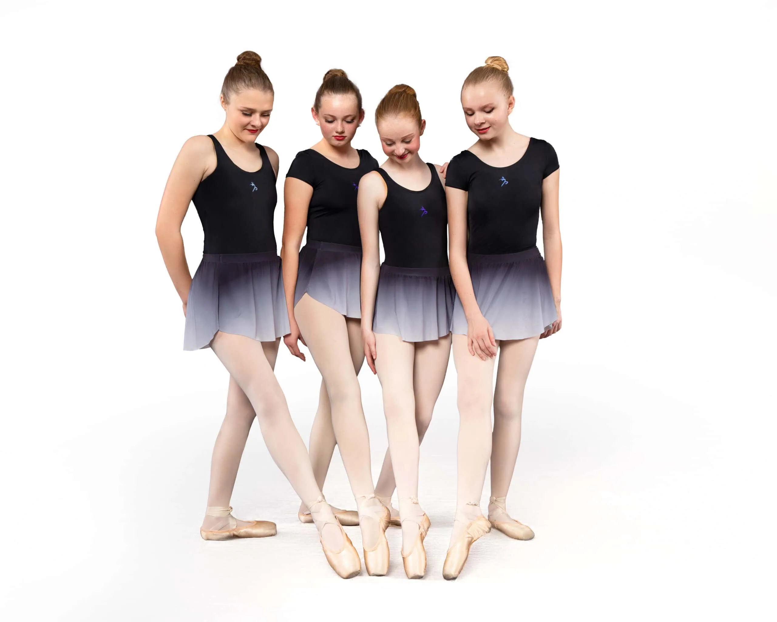 Four ballet dancers in formation.