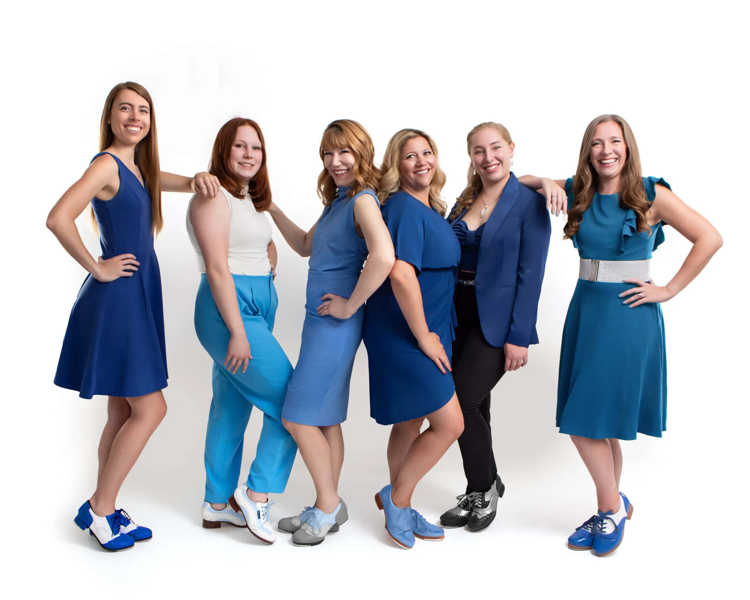 Six women in blue outfits.