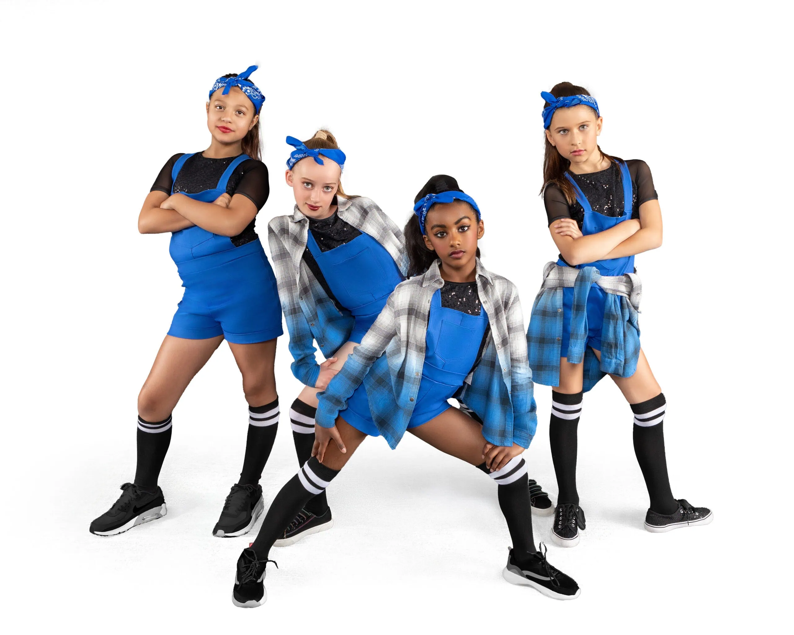 Four dancers in blue outfits.